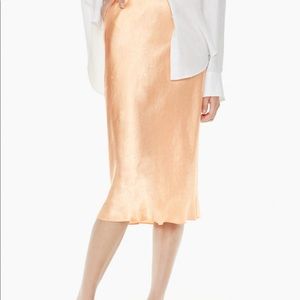 Silk midi slip skirt with an elastic band.